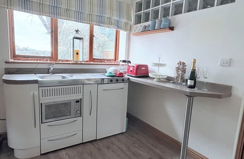Lea Marston Apartment | A beautifully styled duplex apartment with private riverside decking& a fire pit