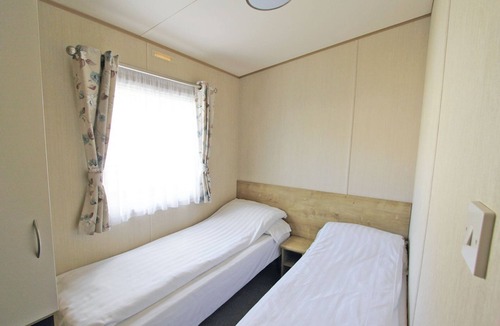 Alford House | Caravan with one double and two twin.