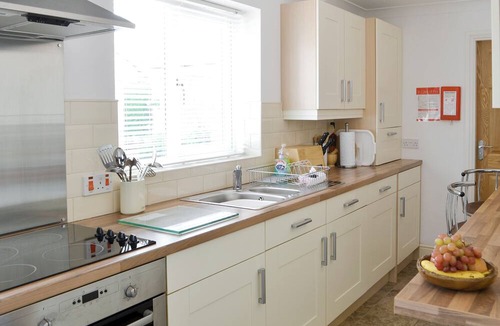 Woodhorn Cottage | Lovely property with an open staircase leading to 2 bedrooms and a bathroom.