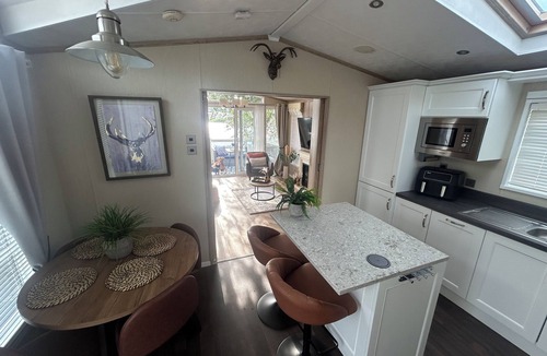 Tattershall Cabin | Luxury lakeside lodge with hot tub and sunset views. Pet friendly, 3 bedrooms