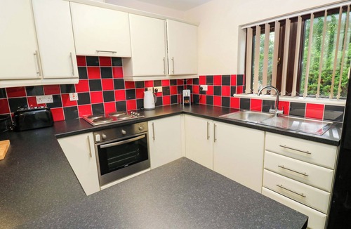 Brighouse Cottage | THE LODGE, pet friendly, with a garden in Brighouse