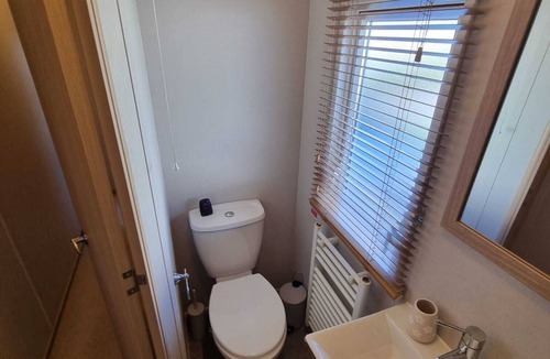 Grimsby House | Unwind in our stunning premium waterside retreat. Full wraparound decking