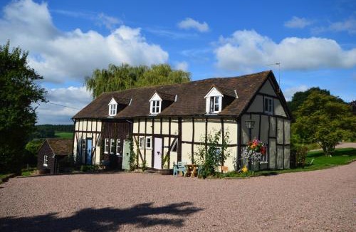 Hay-on-Wye House | Whitewells Farm Cottages - 7 exceptionally well appointed pet friendly barn conversions set in 10 acres of gardens, fields and woodland suitable from 2 to 24 people with breathtaking views towards the Malvern Hills, Herefordshire and Worcestershire