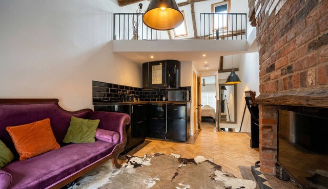 Exposed beams, working fireplace and complimentary weekend cocktails