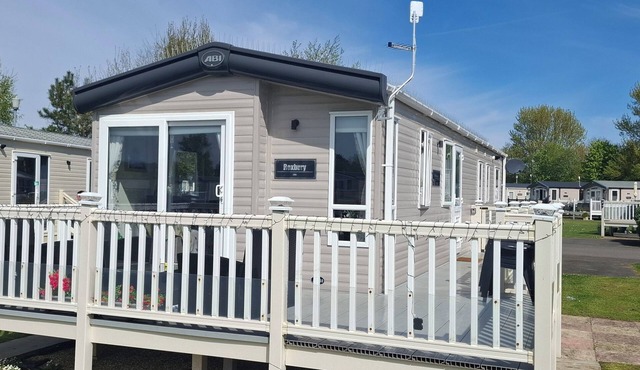 Unwind in our stunning premium waterside retreat. Full wraparound decking